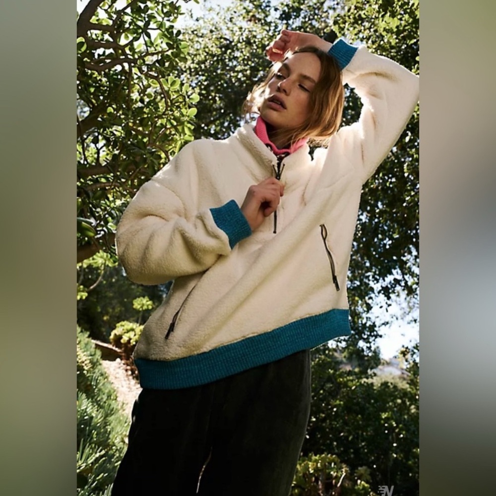 So cozy fleece pullover featuring a high neckline and half-zip closure